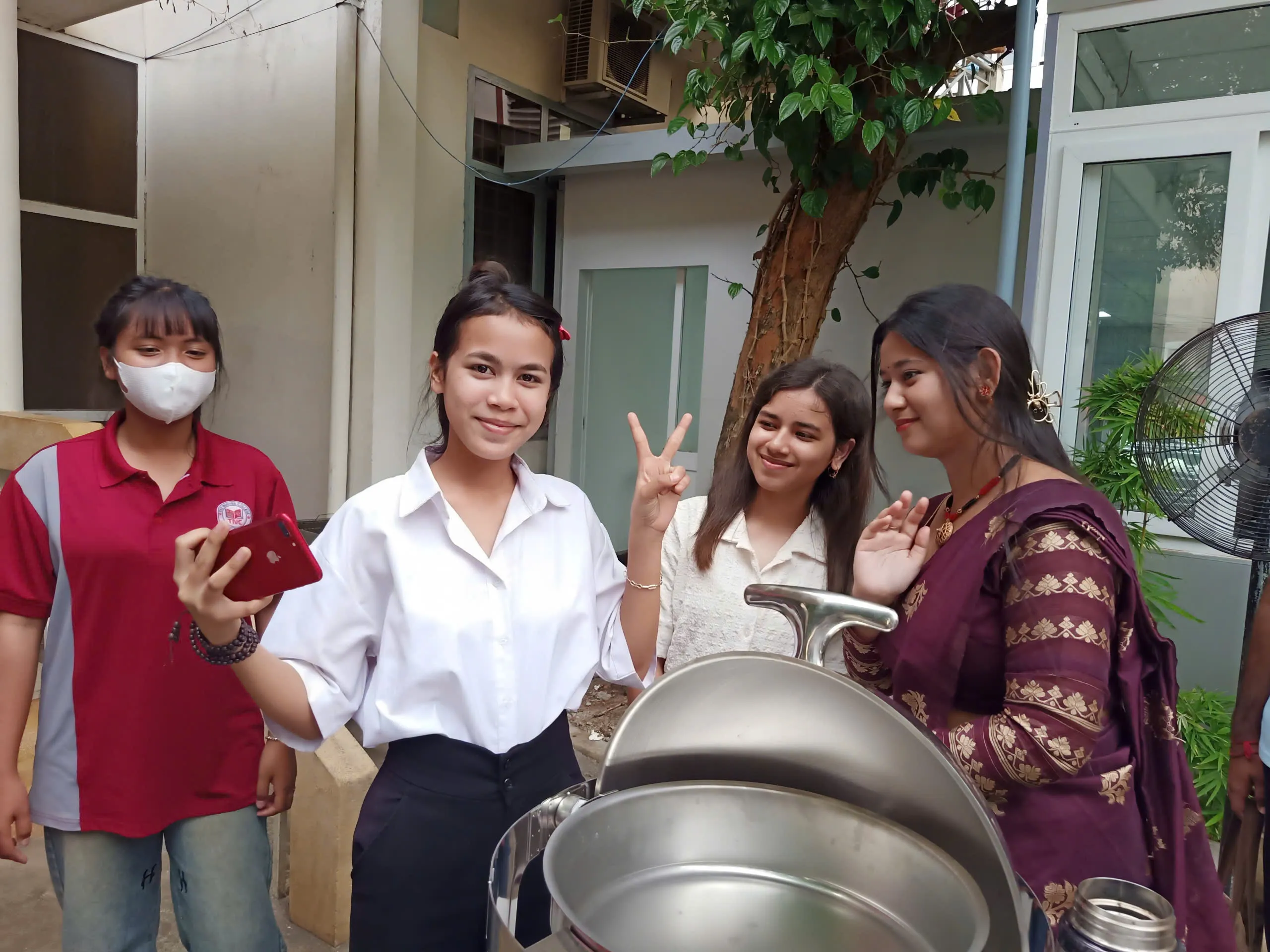 - Indian students dressed in graduation gowns at convocation